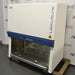 Esco Labculture Class II Type A2 4-foot biosafety cabinet ka right angle view, jisme right side panel, Labculture branding, biohazard symbol, stainless steel workspace, aur mobile caster cart base saaf dikhai de rahe hain.   