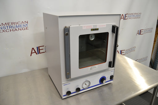 Angled perspective view of a Fisher vacuum oven model 281A showing its right side panel, latch handle, and front control setup on a stainless steel surface