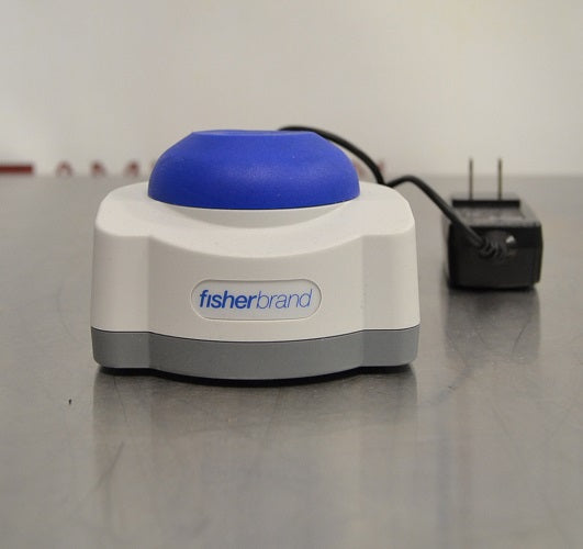 Front eye-level view of Fisherbrand mini vortex mixer showing blue rubber head, front logo plate, and AC power adapter on the side