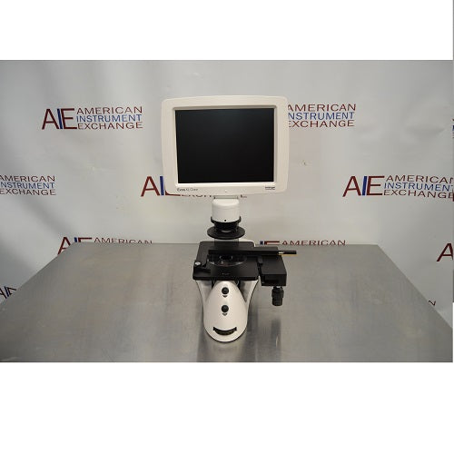 Front eye-level view of an Invitrogen EVOS XL Core cell imager resting on a stainless steel surface highlighting its integrated LCD display screen and mechanical stage