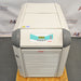 Front product view of a Julabo FL1701 recirculating chiller, featuring its white and gray housing, digital control panel display, and lower slatted ventilation grille on a wooden platform