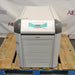 Julabo FL1703 recirculating chiller sitting on a wooden pallet showing front louvered ventilation grille, pressure gauge on left panel, and top digital control display