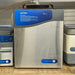 Front angle product view of a Labconco CentriVap cold trap unit, featuring a brushed stainless steel front panel, blue upper control console with operational instructions, and adjacent laboratory equipment