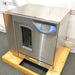 Right three-quarter angle product view of a Labconco FlaskScrubber Vantage 422101010 glassware washer, showcasing its stainless steel body, control panel, and viewing window on a wooden pallet base