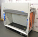 Angled perspective view of a Labconco Protector Premier laboratory fume hood highlighting its right side panel wiring, black interior work base, and front fascia