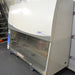Right angled perspective view of a Labconco Purifier Logic+ biosafety cabinet on a rolling platform displaying the side panel, front glass sash, and upper control housing