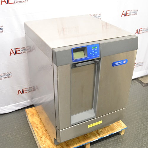 Angled side perspective view of Labconco SteamScrubber Glassware Washer model 4400420 showing stainless steel side panel, control interface, and door handle