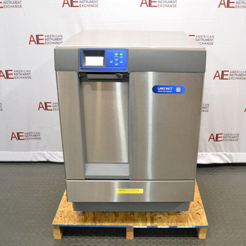 Front view of Labconco SteamScrubber Glassware Washer model 4400420 featuring stainless steel door, blue LCD control panel, and door handle mounted on wooden pallet