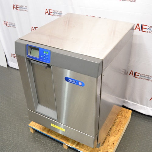 High-angle perspective view of Labconco SteamScrubber Glassware Washer model 4400420 showing stainless steel top surface, front control panel, and side panel on wooden pallet