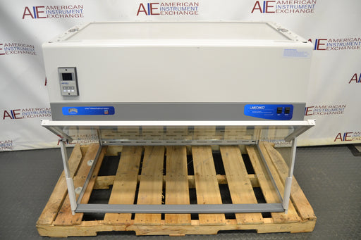Angled perspective view of a Labconco XPert Filtered Balance System sitting on a wooden pallet, highlighting its upper filter housing, digital meter, control switches, and front frame