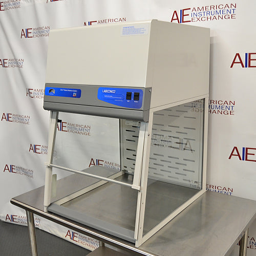Right three-quarter angle product view of a Labconco XPert filtered balance system powder containment hood, showcasing its upper filter enclosure, control panel, clear side panels, and stainless steel support table