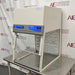 Right three-quarter angle product view of a Labconco XPert filtered balance system powder containment hood, showcasing its upper filter enclosure, control panel, clear side panels, and stainless steel support table