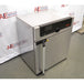 High-angle perspective view of a Memmert Universal Oven UN30 showing its stainless steel cabinet, door handle, and top front control display module