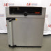 Front view of a Memmert Universal Oven UN30 with a stainless steel door, vertical handle, and top control glass panel featuring the Memmert logo
