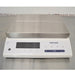 Front product view of a Mettler Toledo MS12001L/03 high-precision toploading balance, featuring a large rectangular stainless steel weighing pan, white housing, digital display screen, and integrated control keypad on a stainless steel lab bench