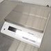 Left three-quarter angle product view of a Mettler Toledo MS12001L/03 high-precision toploading balance, showing its stainless steel weighing pan, white housing, digital control screen, and keypad on a stainless steel bench