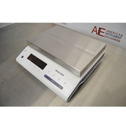 Left angled perspective view of Mettler Toledo MS32001L A03 precision balance showing stainless steel weighing platform and front digital control panel