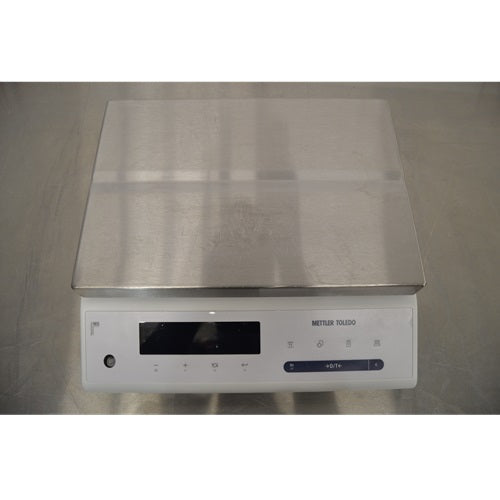 Top down front view of Mettler Toledo MS32001L A03 precision balance featuring stainless steel weighing platform and digital display interface
