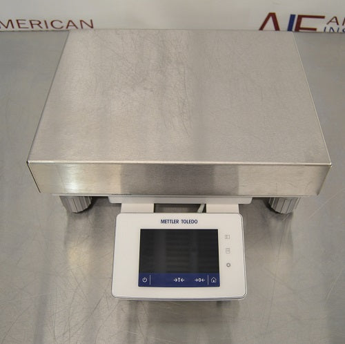 Front perspective view of Mettler Toledo XSR10001L precision balance showing stainless steel weighing platform and front digital control panel