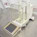 Mettler Toledo XP26DR microbalance ka right angle view, jisme right side weighing mechanism housing, glass draft chamber, aur digital control terminal saaf dikhai de rahe hain.   