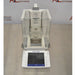 Front view of Mettler Toledo XPE26 microbalance featuring a glass draft shield enclosure, internal weighing chamber, and detached front touchscreen control terminal