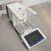 Mettler Toledo XPR106H dual-range analytical balance ka right angle view, jisme glass draft shield ka right side, precision weighing pan, aur front par laga hua touch screen terminal saaf dikhai de raha hai.   