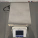 Top-down product view of a Mettler Toledo XS32001L precision balance, showcasing its large stainless steel weighing pan and front-facing digital control terminal