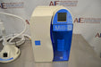 Close-up front view of a Millipore Milli-Q Integral 15 water purification main processing unit highlighting its digital control screen, blue cabinet accents, and internal cartridge housing