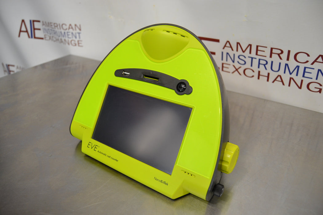 Right angled perspective view of a NanoEnTek EVE-MC automatic cell counter in a lime green finish, showcasing its touchscreen interface, slide slot, and side adjustment knobs on a stainless steel work surface