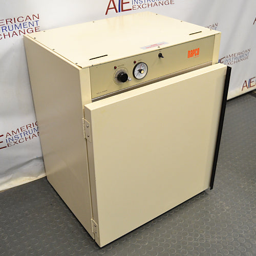 Front angled perspective view of a Napco E Series 301 incubator, featuring an off-white cabinet body, top-mounted control panel with a rotary dial and analog gauge, and the front door slightly ajar