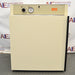 Front eye-level view of a Napco E Series 301 incubator, featuring an off-white outer cabinet, a solid closed front door with a dark vertical handle on the right, and a top control panel equipped with a rotary dial, analog gauge, and Napco branding