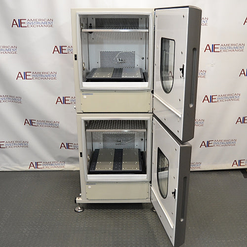 Front product view of a New Brunswick Innova 42R stacked refrigerated incubator shaker system with both outer doors swung open, revealing the internal stainless steel chambers, internal platform mechanisms, and back wall venting
