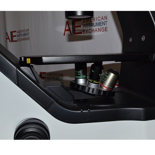 Close-up view of a Nikon Eclipse Ts2 inverted microscope, highlighting the stage, angled objective nosepiece with installed lenses, and focus controls