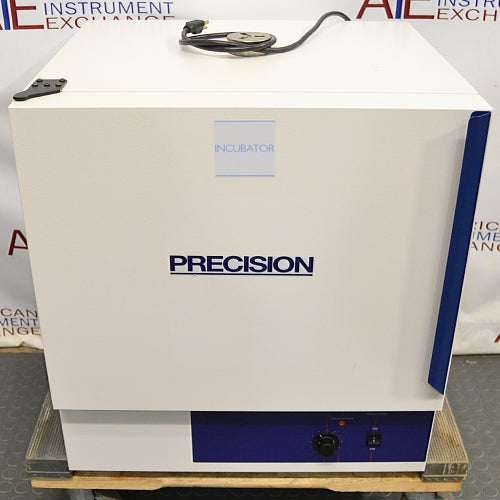 Front eye-level view of a Precision 3EG incubator resting on a wooden pallet, featuring a white exterior housing, bold Precision branding on the front door, a blue vertical side accent, and a lower control panel with a rotary dial and power switch