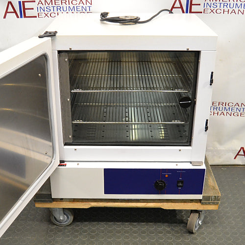 Front angled view of a Precision 3EG incubator with its outer door swung open, showcasing the interior wire shelving, inner glass door, and lower control panel on a wheeled pallet