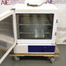 Front angled view of a Precision 3EG incubator with its outer door swung open, showcasing the interior wire shelving, inner glass door, and lower control panel on a wheeled pallet
