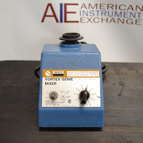 Front product view of an S/P Scientific Products Vortex-Genie mixer, featuring its blue cast housing, top rubber mixing cup, front power switch, speed control dial, and specification label on a dark workbench