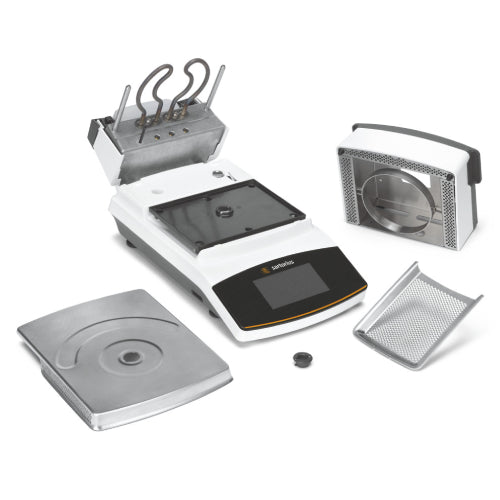 Left angle product view of a Sartorius MA160 moisture analyzer displayed with its detachable components, including the stainless steel weighing pan, heating chamber insert, and mesh protective tray