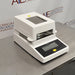 Left angle product view of a Sartorius MA35 infrared moisture analyzer, showcasing its white housing, top ventilation grill, heating chamber opening, and angled front control panel with a digital display