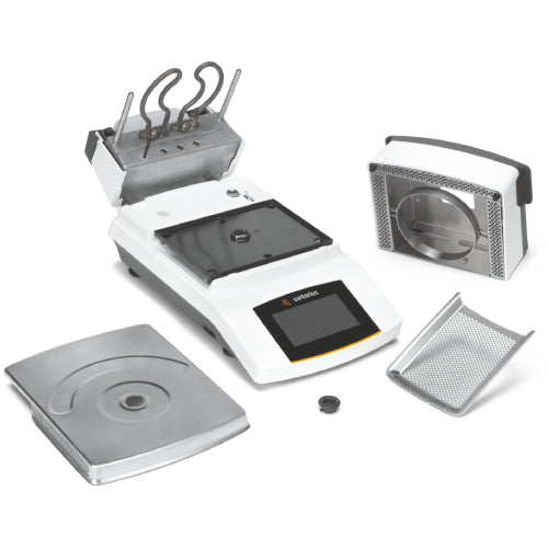 Left angle product view of a Sartorius MA37 moisture analyzer displayed with its detachable components, including the stainless steel weighing pan, heating chamber insert, and mesh protective tray