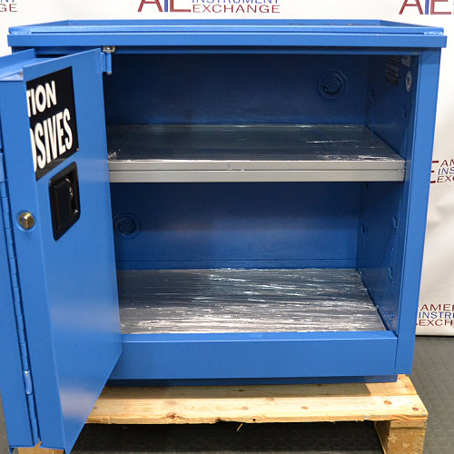 Front view of an unused Securall 24-gallon corrosive storage cabinet with its door swung open, revealing an empty interior compartment, protective shelf lining, and durable blue steel frame construction