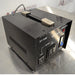 Left three-quarter angle product view of a Seven Star ST-1000 step up and down voltage transformer, showcasing the side ventilation slots, top handle, front faceplate with 110V and 220V output sockets, and power switch on a lab bench