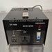 Straight-on front view of a Seven Star ST-1000 step up and down voltage transformer, featuring the 110V and 220V output sockets, blue toggle power switch, power source indicator light, and top handle on a stainless steel surface