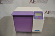 Front eye-level view of a Seward Stomacher 400 Circulator lab blender, featuring a white cabinet body with a purple paddle chamber door, top digital control panel, and LCD screen resting on a stainless steel counter