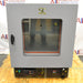 Front eye-level view of a Shel Lab 1445 vacuum oven resting on a wooden pallet, featuring a grey exterior, a glass viewing door with a latch handle, and a bottom control console with digital displays and switches