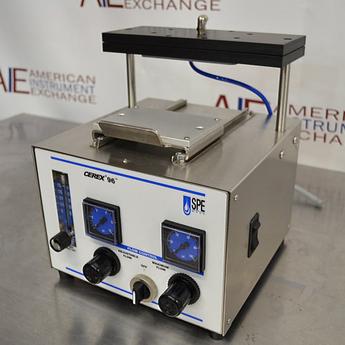 Left three-quarter angle product view of an SPE ware CEREX 96 processor, highlighting the side power switch, front control panel, flow gauges, and upper stage on a stainless steel surface