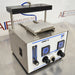 Three-quarter angle product view of an SPE ware CEREX 96 processor, highlighting the side power switch, front control panel, flow meter, gauges, and upper mounting rack on a stainless steel counter