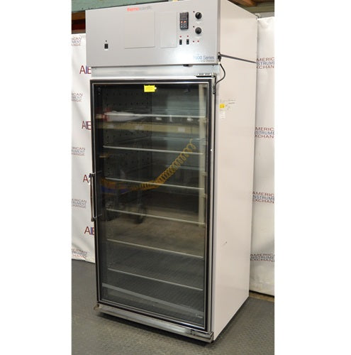 Angled perspective view of Thermo Forma Model 3920 glass door environmental chamber showing top control unit, side panel, and interior shelves through glass door