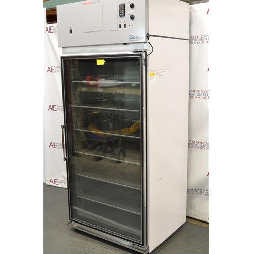 Right angled perspective view of Thermo Forma Model 3920 glass door environmental chamber displaying glass door, front control console, and internal wire shelving