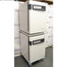 Left angled perspective view of a stacked pair of Thermo Heracell VIOS 160i CO₂ incubators on a rolling stand with closed doors showing touch display panels
